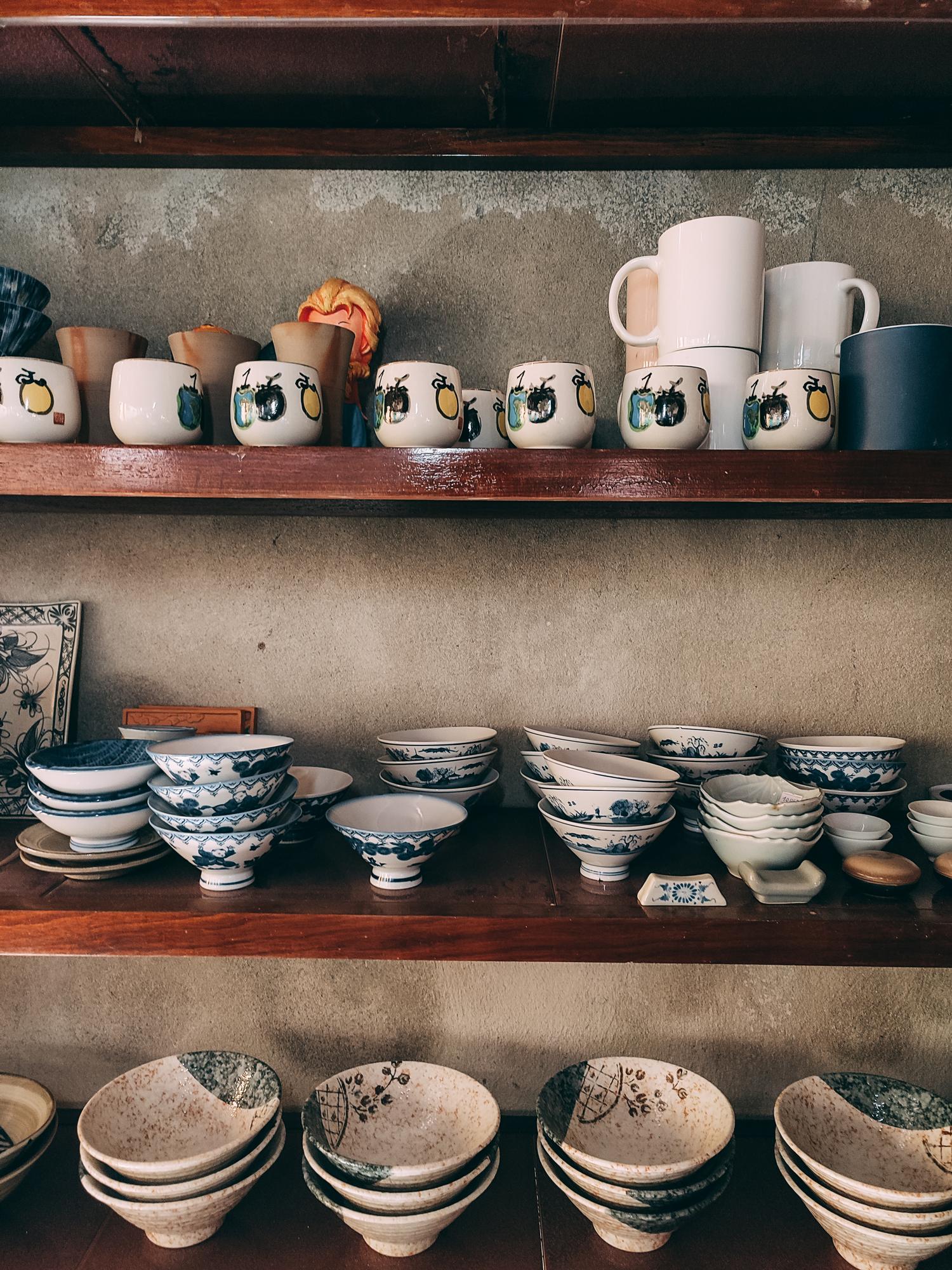 Ceramic studio plates stacked on shelf