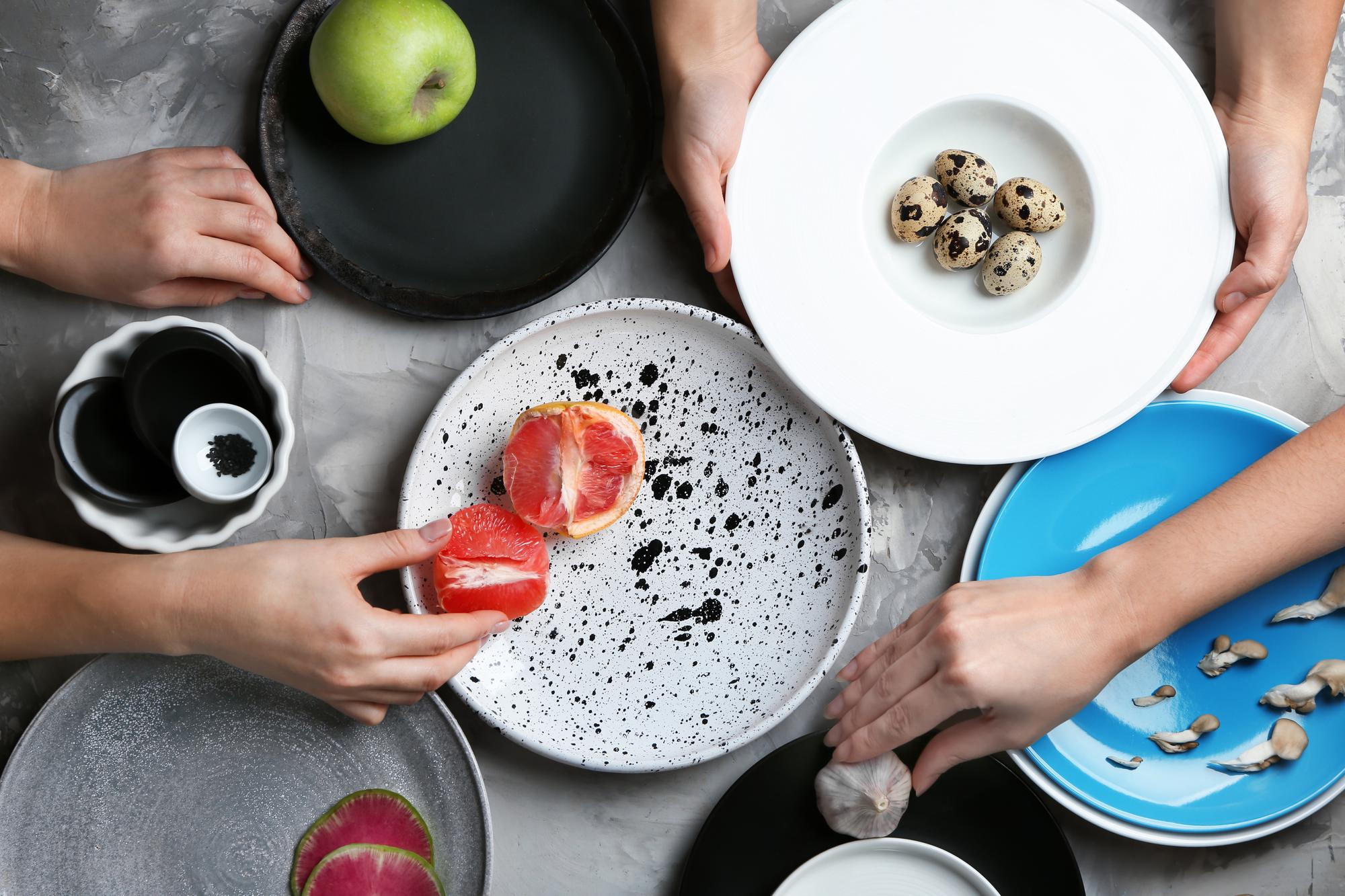 Class participants learning to plate dishes