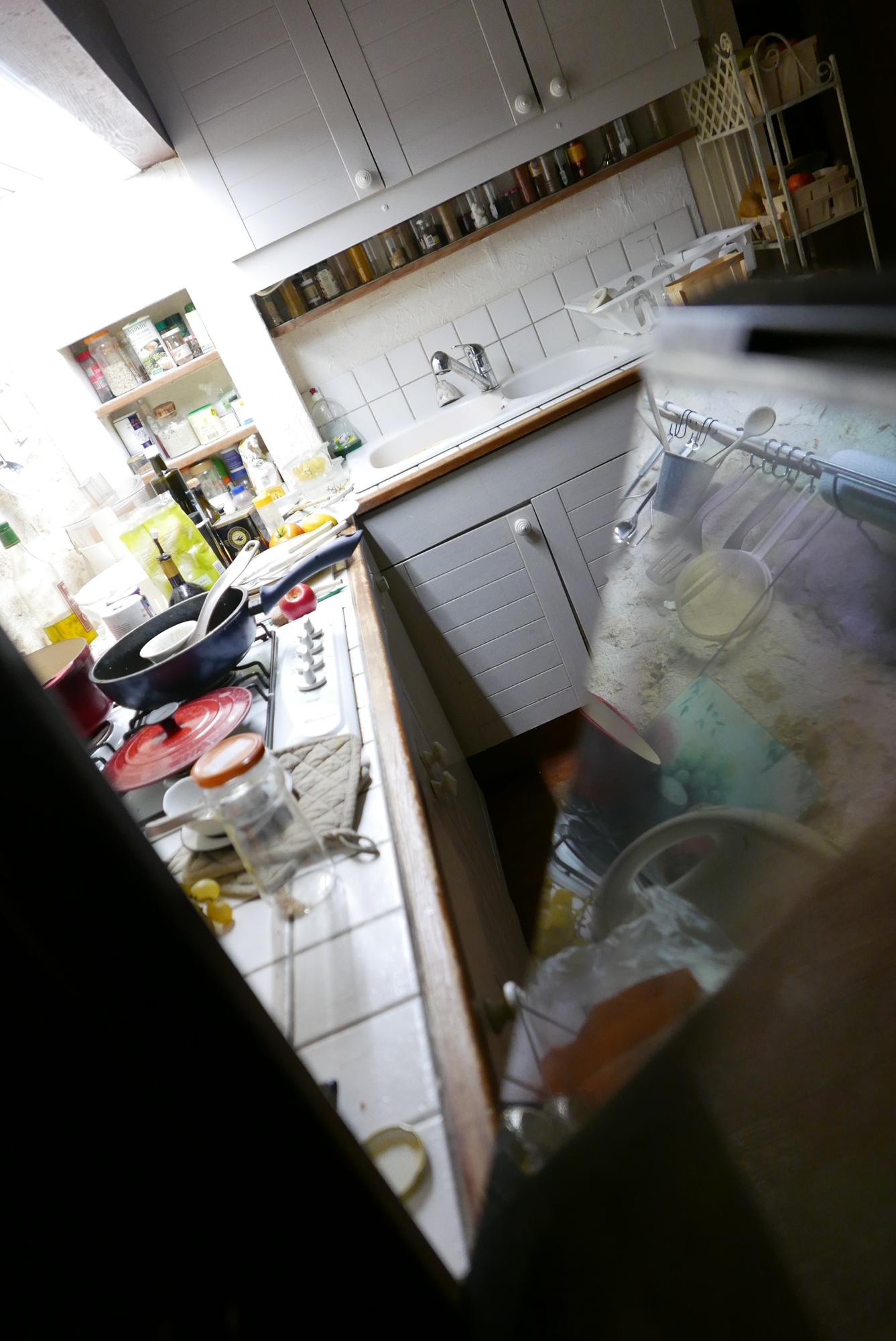 Overfilled fridge with unused leftovers